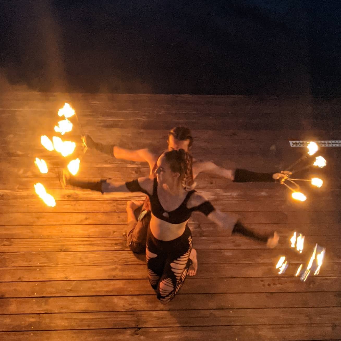 Fire performers on the deck at night
